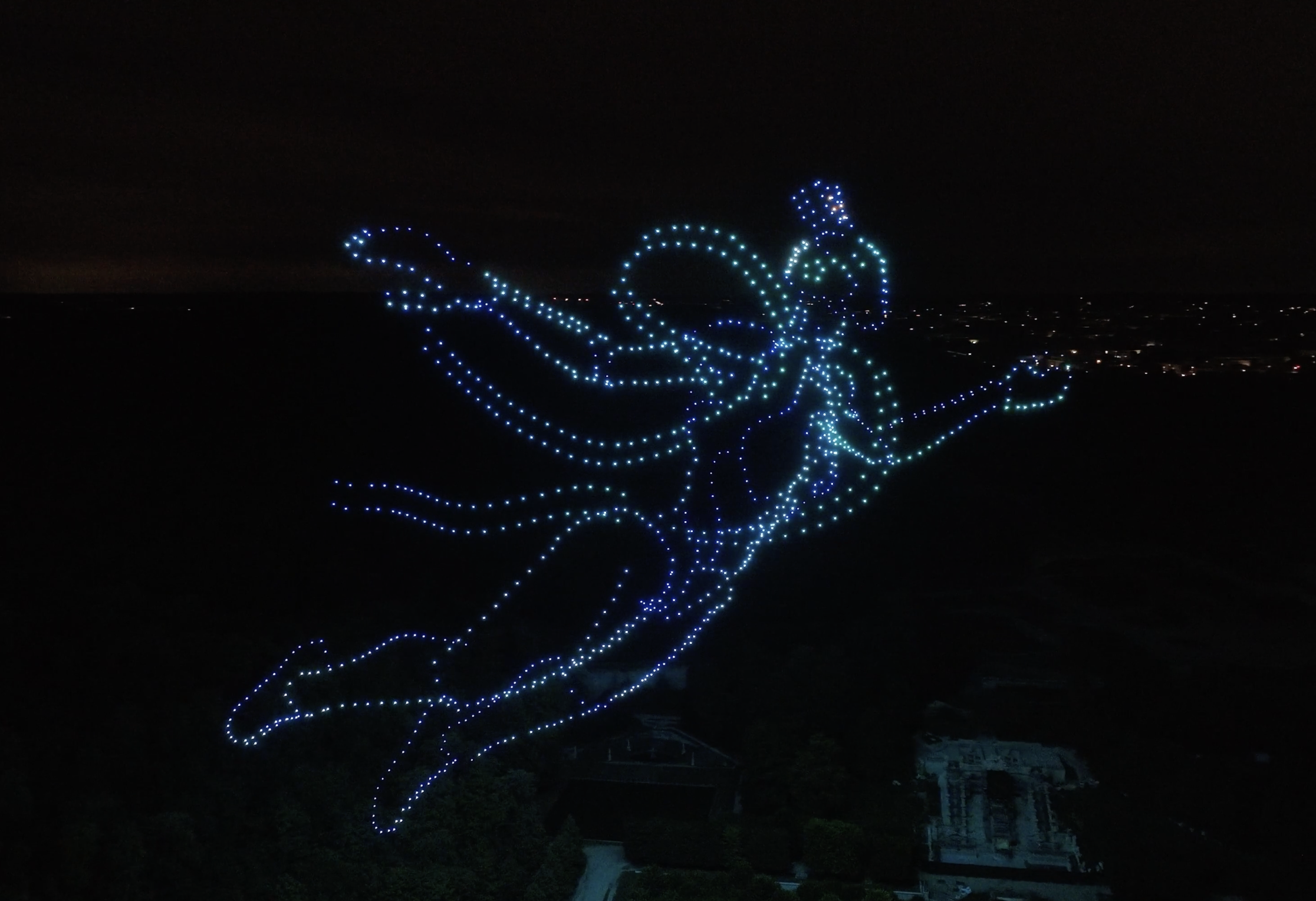 Figure de danseuse en drones lumineux bleus